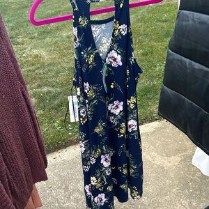 Brand new w/tags, blue floral dress, little over knee length on my 5’4 frame